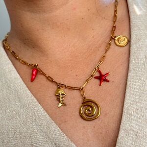 Gold Charm Necklace with Red Accents